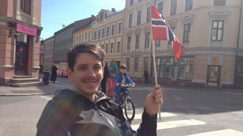 Ronald Huereca with Norwegian flag for May 17 Celebration