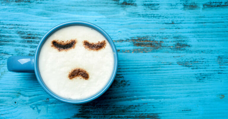 Coffee cup with annoyed look on its face